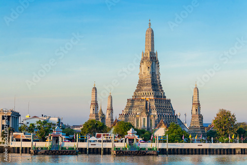 Beautiful of Buddhist temple or Wat Arun Ratchawararam Ratchawaramahawihan with famous tourist landmark sunlight in the morning, Bangkok, Thailand.