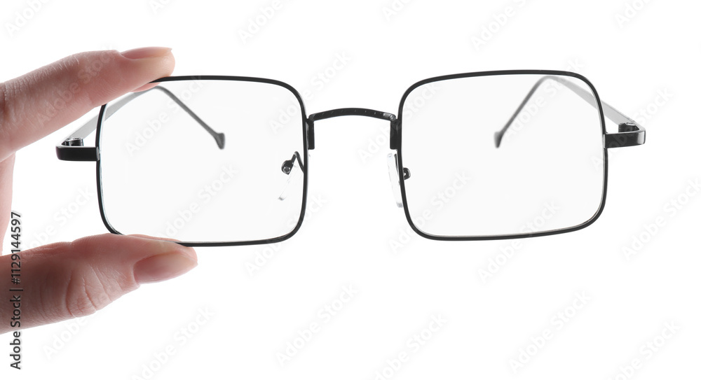 Woman holding glasses with black metal frame on white background, closeup Woman holding glasses with black metal frame on white background, closeup