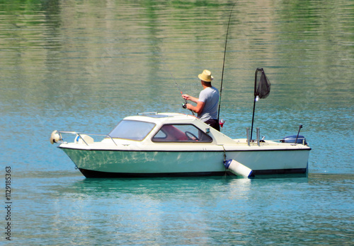 Fishermens on the Lake Lungern or Natural reservoir Lungerersee - Canton of Obwald, Switzerland (Fischer am Naturstausee Lungernsee oder Lungerensee - Kanton Obwald, Schweiz) photo