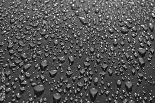 water drops on grey glass close up