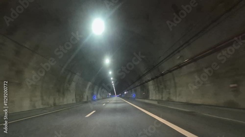 Full 5.7km time-lapse of the Marao Tunnel on the A4 motorway connecting Amarente and Vila Real, Portugal captured during the day. photo