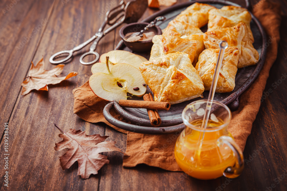 Fototapeta premium Homemade flaky pastry filled with apple mousse and cinnamon