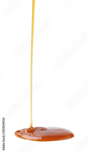 Tasty caramel sauce dripping on white background, closeup