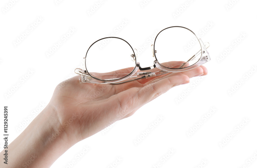 Woman holding glasses with stylish transparent frame on white background, closeup Woman holding glasses with stylish transparent frame on white background, closeup