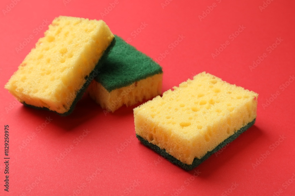 Soft sponges on red background. Cleaning tool Soft sponges on red background. Cleaning tool