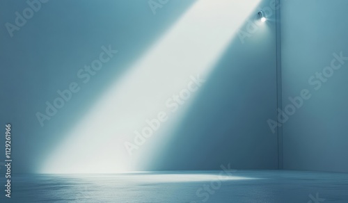 Single light beam illuminates a minimalist, empty room corner.