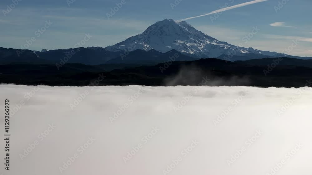 Mount Rainier Emerging Through a Sea of Clouds Mount Rainier Emerging Through a Sea of Clouds