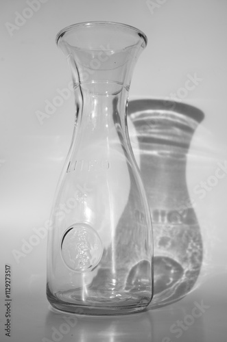 Typical Italian one-liter bottle, clear glass carafe, branded size, vintage.