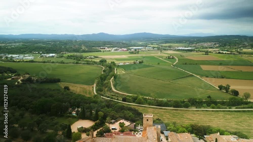 Castell d Emporda hotel with garden against farm fields