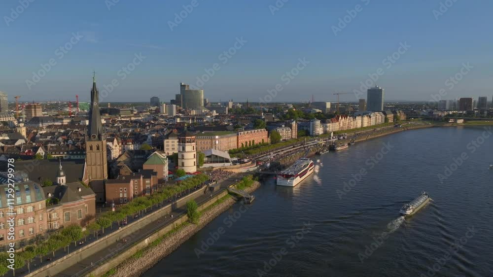 Dusseldorf cityscape Old Town City center Aerial Shot in evening light. Rhine River Embarkment in Duesseldorf, Germany. Dusseldorf cityscape Old Town City center Aerial Shot in evening light. Rhine River Embarkment in Duesseldorf, Germany.