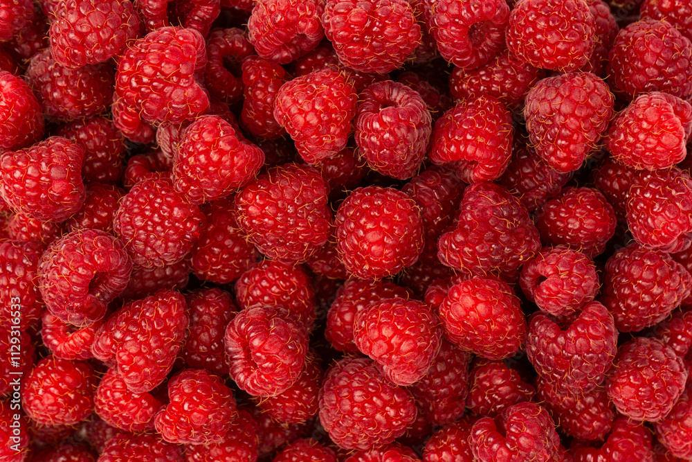 Tasty fresh raspberry as a background. Tasty fresh raspberry as a background.