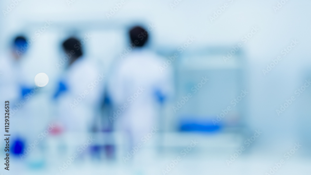 Obraz premium Defocused View of Scientists Working in a Research Laboratory Blurred Baclground With Copyspace