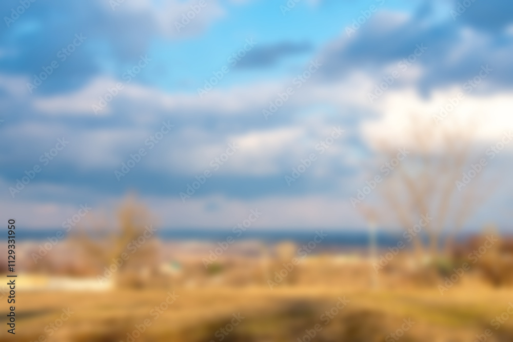 Blurred spring city background with clouds Blurred spring city background with clouds
