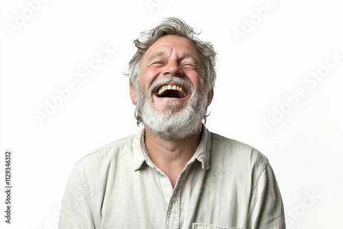 Joyful elderly man with gray beard laughs heartily.