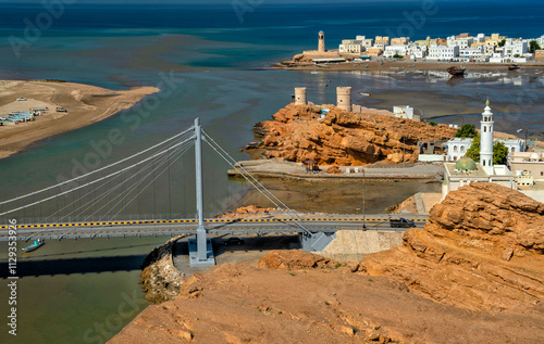 Sur, Oman. Fortress and Lighthouse in the ancient harbor. Summer travel and tourism in the East photo