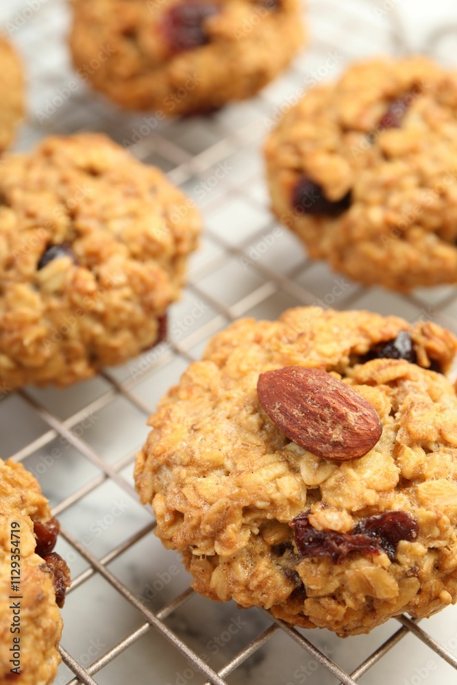 Delicious oatmeal cookies with raisins and nuts on table, closeup Delicious oatmeal cookies with raisins and nuts on table, closeup