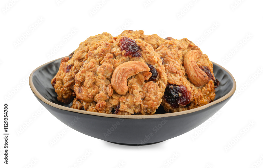 Delicious oatmeal cookies with dried cranberries and nuts in bowl isolated on white