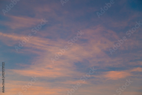 Serene Sunset Sky with Vibrant Orange and Soft Blue Hues