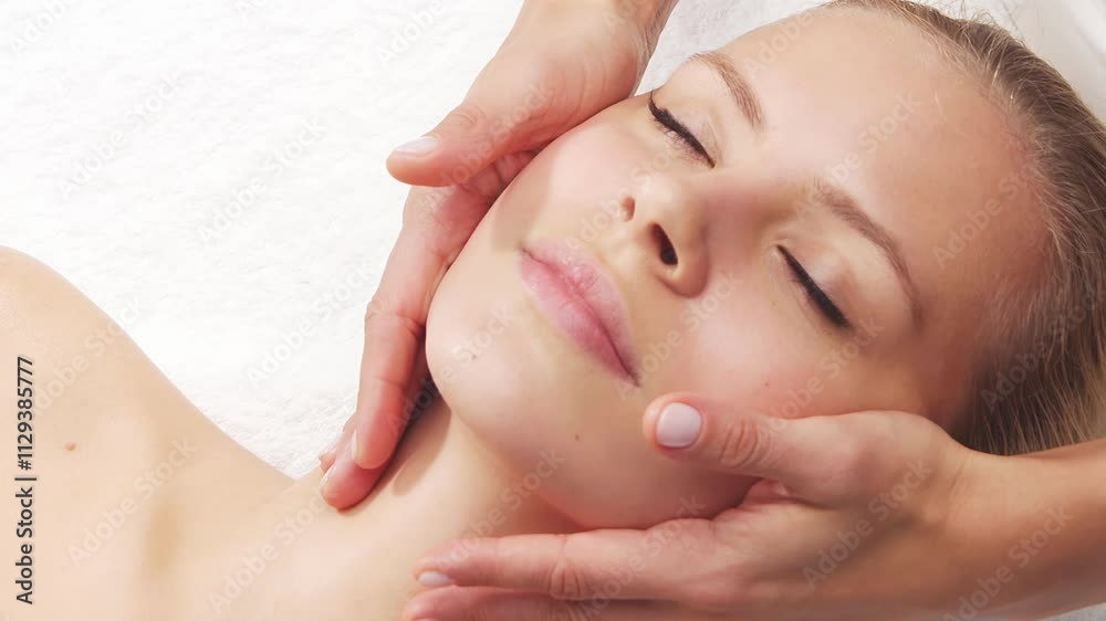 Woman is getting massage treatment from the therapist. Massaging procedure in spa. Healthcare, relaxation, rejuvenation and wellness concept. Woman is getting massage treatment from the therapist. Massaging procedure in spa. Healthcare, relaxation, rejuvenation and wellness concept.