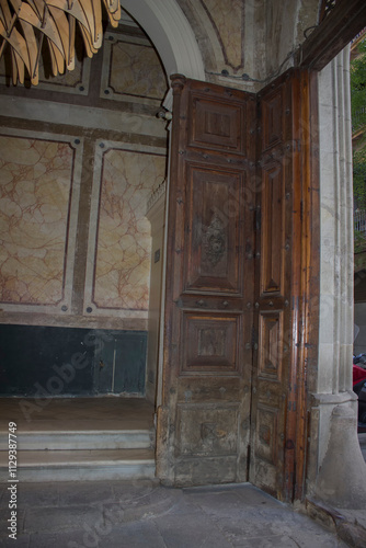 wooden doors in antique building; beautiful hallway with stairs