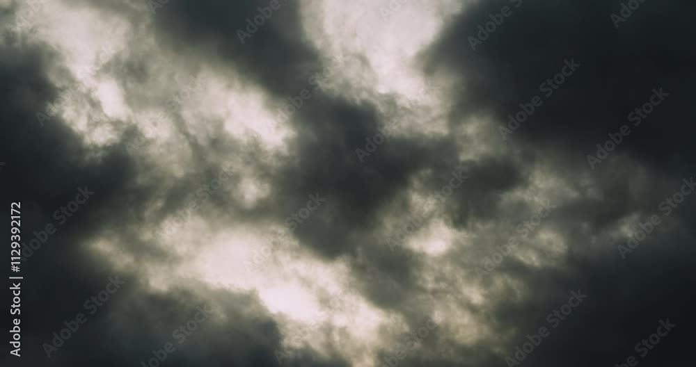Timelapse of detail real view of hypnotically changing dark storm clouds creating mysterious shapes with dramatic abstract effect reminding of smoke Timelapse of detail real view of hypnotically changing dark storm clouds creating mysterious shapes with dramatic abstract effect reminding of smoke