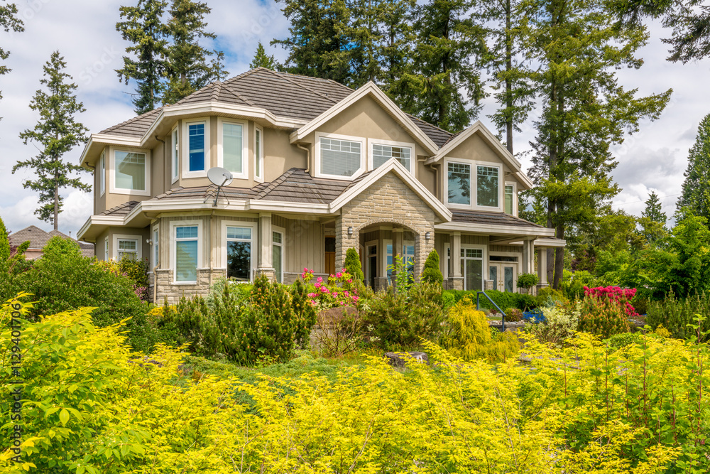 Two story stucco luxury house with nice summer landscape in Vancouver, Canada, North America. Day time on June 2024. Two story stucco luxury house with nice summer landscape in Vancouver, Canada, North America. Day time on June 2024.