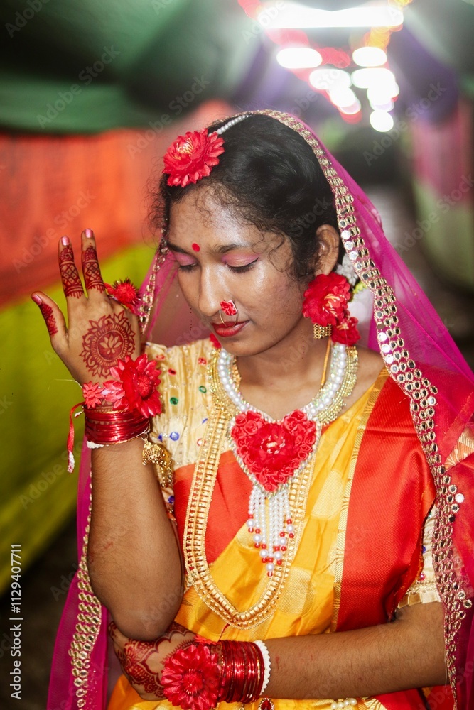 Portrait of a south asian young beautiful bride in traditional colourful costumes, young girl in wedding dress with bridal makeup Portrait of a south asian young beautiful bride in traditional colourful costumes, young girl in wedding dress with bridal makeup