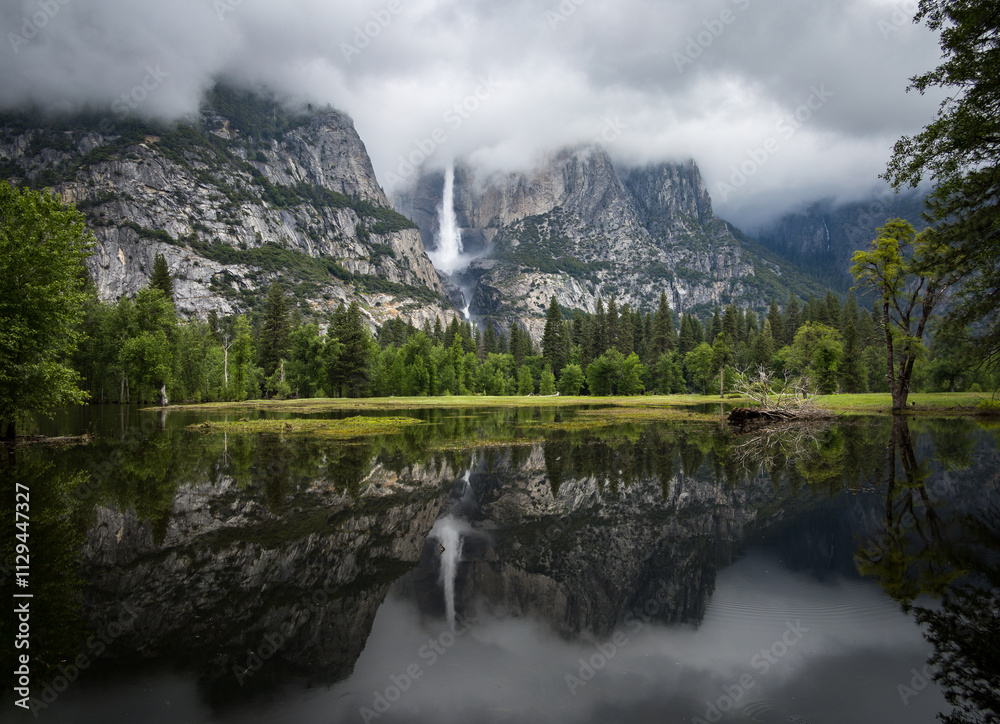 Upper Yosemite Falls with mirror image in Merced River, Yosemite National Park, California