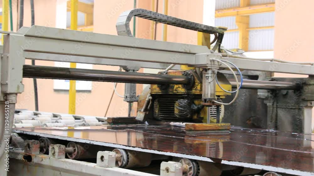 Granite floor slabs being trimmed and finished in a factory setting, showcasing the precision and craftsmanship of the stone cutting process Granite floor slabs being trimmed and finished in a factory setting, showcasing the precision and craftsmanship of the stone cutting process