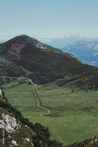 Pathway across green mountain valleys, Asturias, Spain