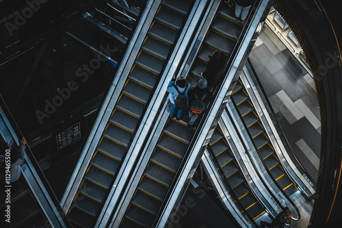 People on the escalator in the mall, top view. Saint Petersburg, Russia - 2 Feb 2024