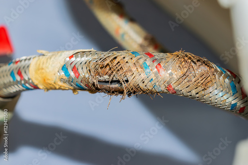 water hose to the mixer with a cracked and rusty braid. replacement is necessary.