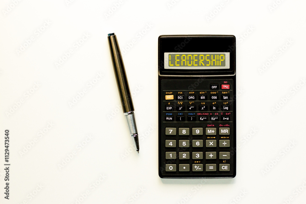 Leadership symbol. Concept word Leadership on beautiful black calculator. Beautiful white paper background. Beautiful black pen. Business leadership concept. Copy space. Leadership symbol. Concept word Leadership on beautiful black calculator. Beautiful white paper background. Beautiful black pen. Business leadership concept. Copy space.