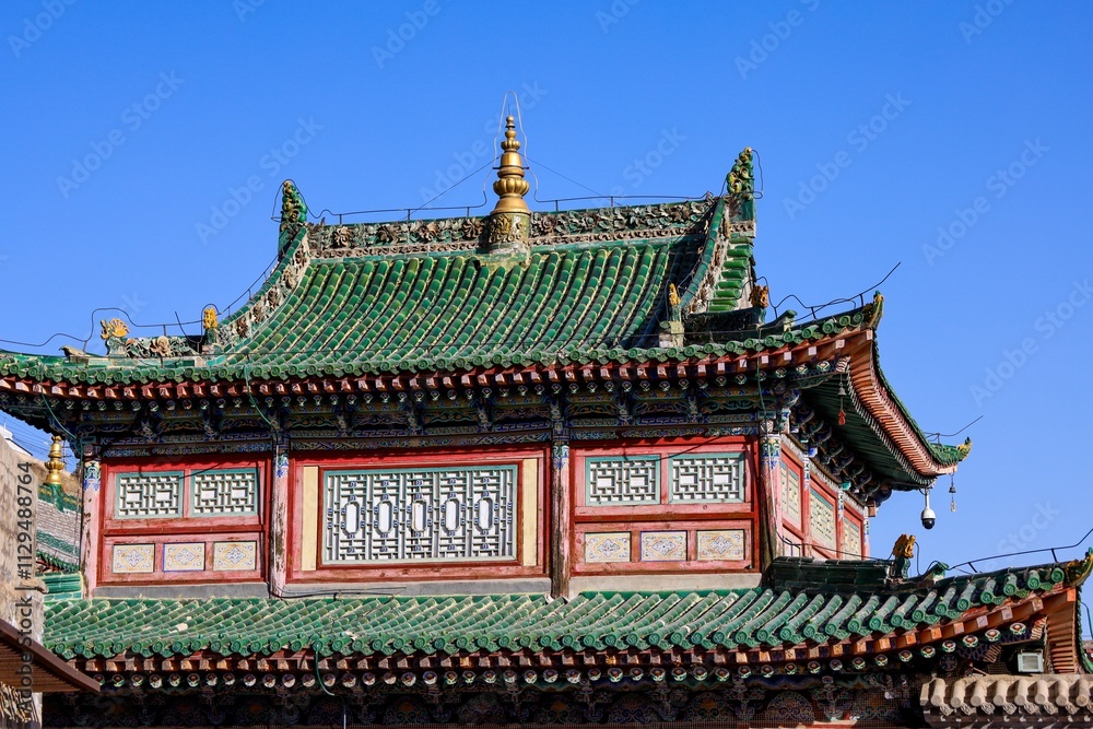 Intricate Tibetan and Chinese architectural details of the Kumbum Monastery (Ta'er Monastery) showcasing traditional design in Qinghai/Amdo region, Tibet. Intricate Tibetan and Chinese architectural details of the Kumbum Monastery (Ta'er Monastery) showcasing traditional design in Qinghai/Amdo region, Tibet.
