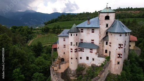 Scenic fairytale medieval castles of Italy - Castel Bragher in Trentino Alto Adige. surrounded by vineyards and forest. aerial drone video
 photo