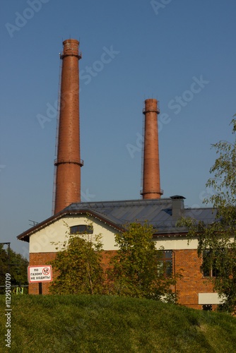 Industrial building chimneys made of bricks. Kronstadt