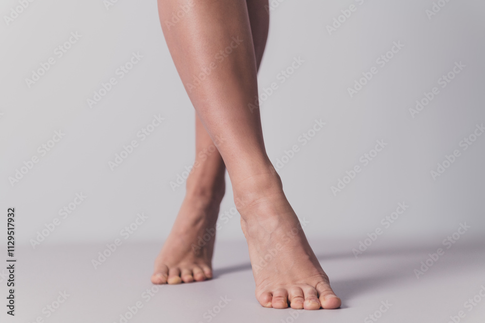 Studio no retouch crop photo of sexy lady legs enjoying soft skin empty space isolated white color background Studio no retouch crop photo of sexy lady legs enjoying soft skin empty space isolated white color background