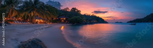 Tropical beach sunset with holiday-lit palm trees