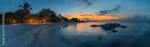 Tropical beach sunset with holiday-lit palm trees