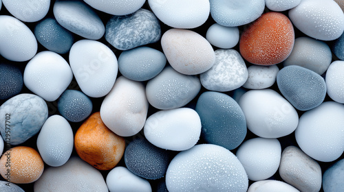 A vibrant close-up view of smooth, frosted multicolored pebbles in various shapes and sizes, captured in high resolution, showcasing intricate textures and natural details for an artistic composition. photo