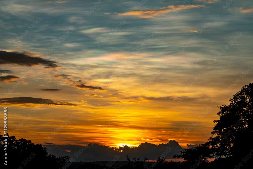 Obraz premium Sunrise with intense natural orange lights and idyllic dramatic scenery