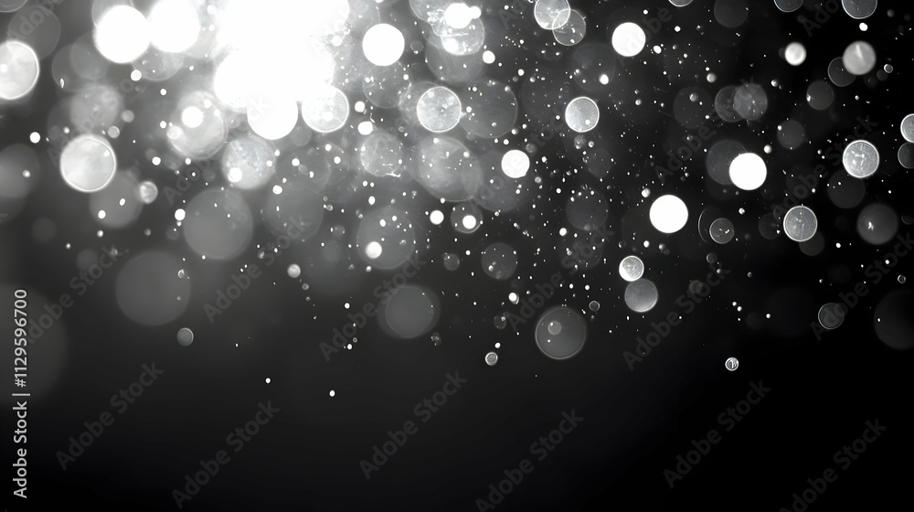 Abstract silver bokeh lights on black background. Abstract silver bokeh lights on black background.