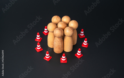 Canvas Print A group of people are surrounded by a barrier of traffic cones