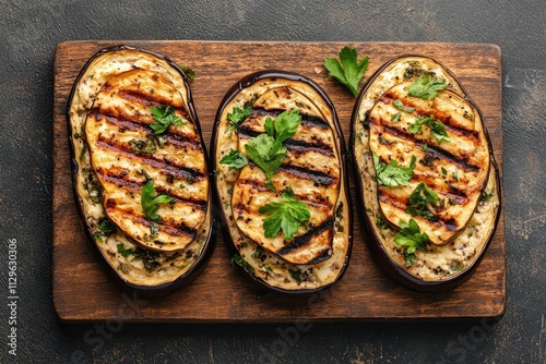 Grilled eggplant and cream cheese on open sandwiches atop a stone table Vegetarian appetizer Bird s eye view Blank space Banner photo