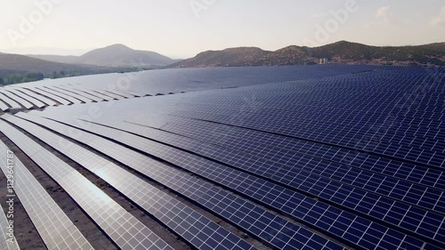 Aerial footage of solar panel fields demonstrating renewable energy innovation. Ideal for sustainability, green technology, and climate-focused projects.
