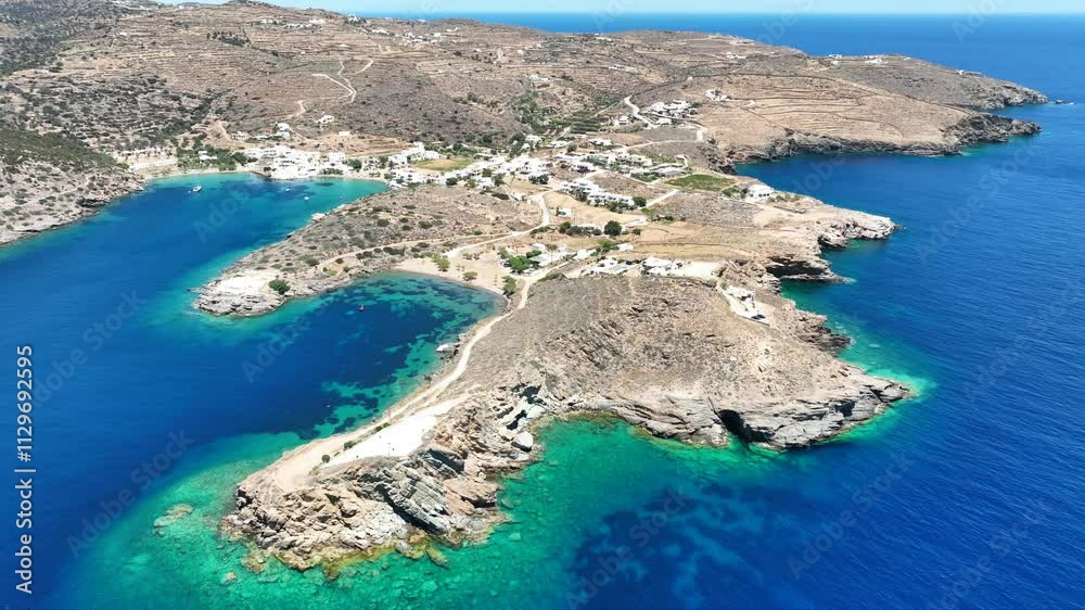 Aerial drone cinematic video of peninsula near picturesque fishing village of Faros and clear water beach of Fasolou, Sifnos island, Cyclades, Greece Aerial drone cinematic video of peninsula near picturesque fishing village of Faros and clear water beach of Fasolou, Sifnos island, Cyclades, Greece