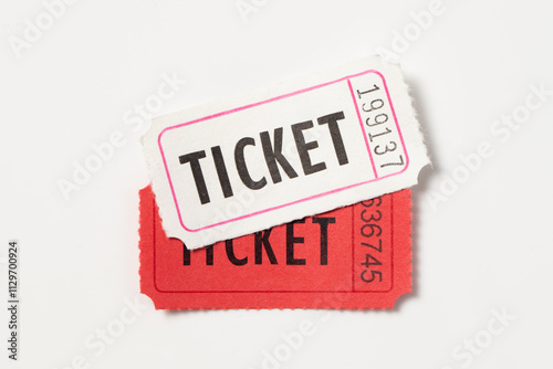 One red and white vintage admission tickets
