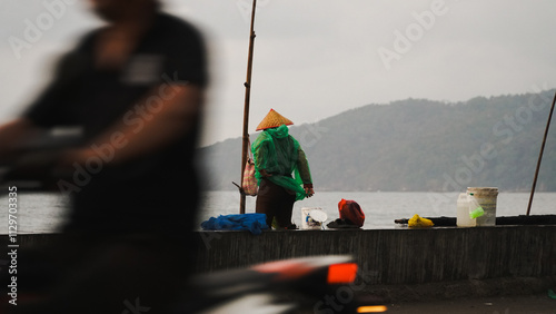 fishermen who are ready to work on a rainy morning photo