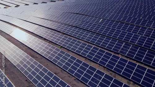 Expansive solar farms captured by drone, showcasing the future of clean energy. Perfect for projects about renewable energy and sustainable development.