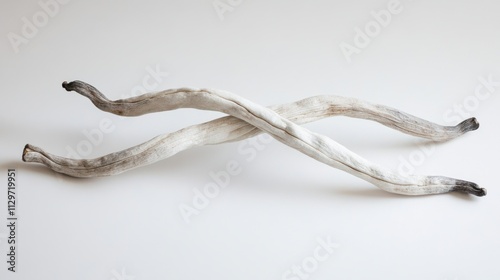 Elegant Crossed Sticks on White Background Showcasing Natural Texture and Minimalistic Design for Artistic or Creative Projects